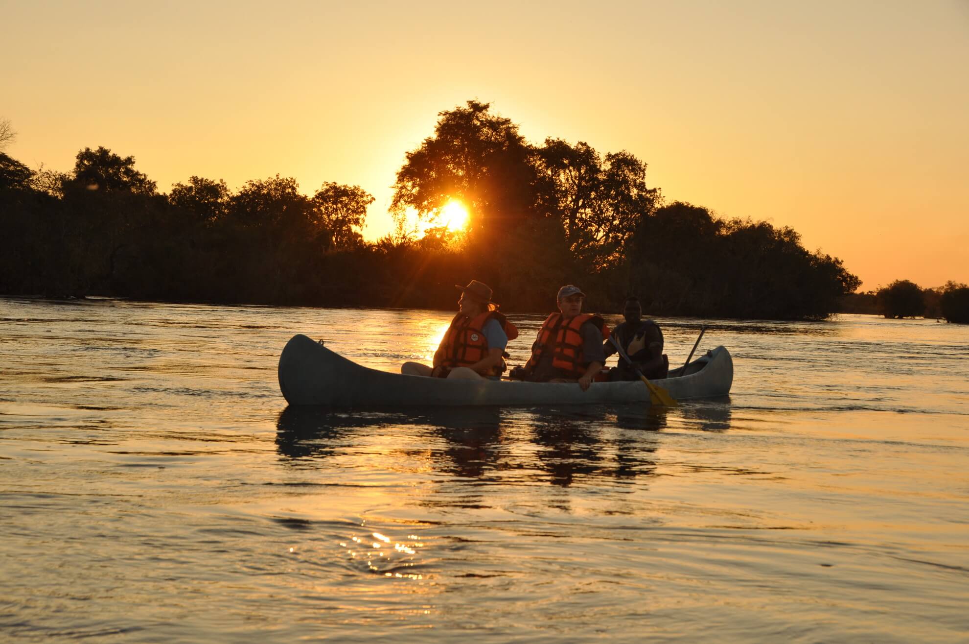 Canoes on the Zambezi at sunset
